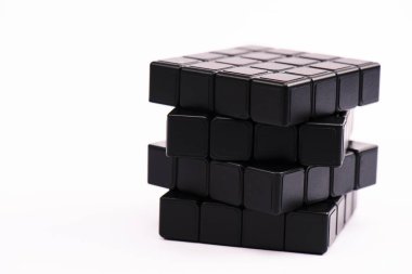 KYIV, UKRAINE - FEBRUARY 21, 2020: black rubik cube isolated on white with copy space  clipart