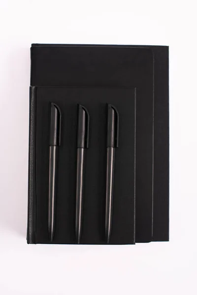 Top View Pens Black Copy Books Isolated White — Stock Photo, Image