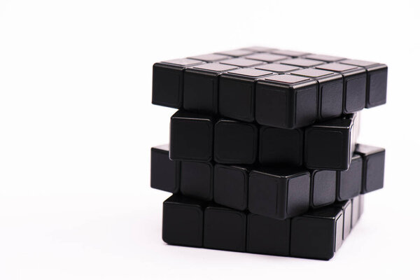 KYIV, UKRAINE - FEBRUARY 21, 2020: black rubik cube isolated on white with copy space 