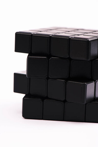 KYIV, UKRAINE - FEBRUARY 21, 2020: close up of black rubik cube isolated on white 