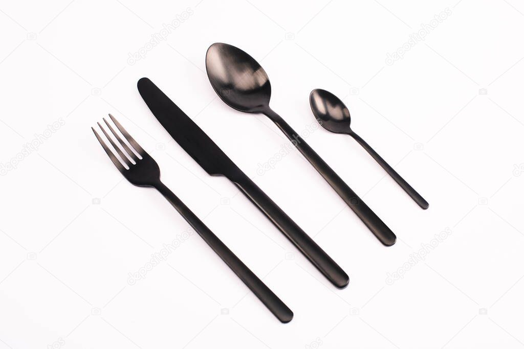 top view of fork, knife and spoons isolated on white 