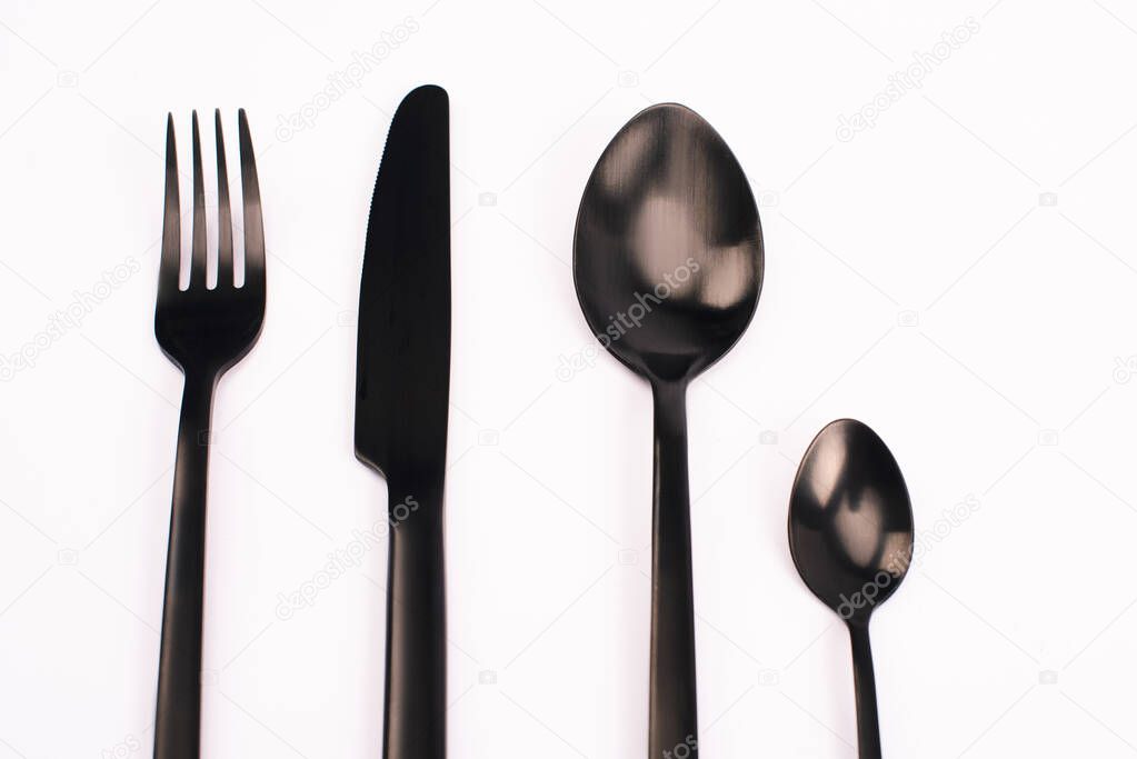 top view of knife, fork and spoons isolated on white 