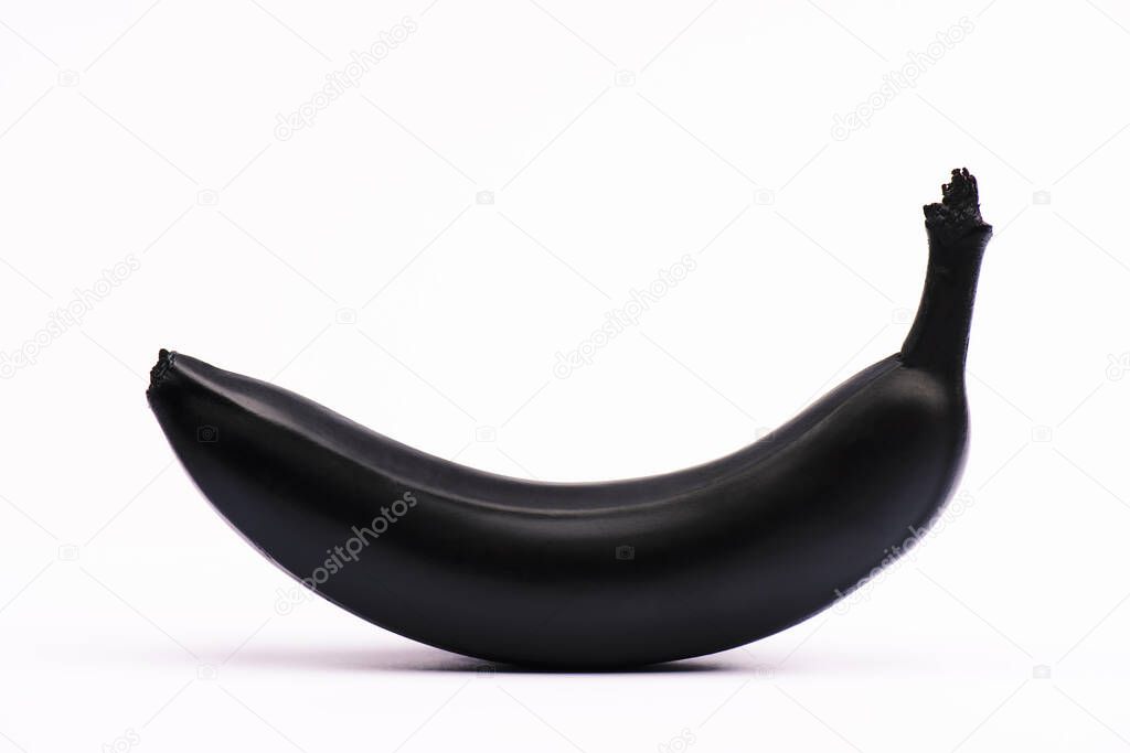 black and nutritious banana on white with copy space 