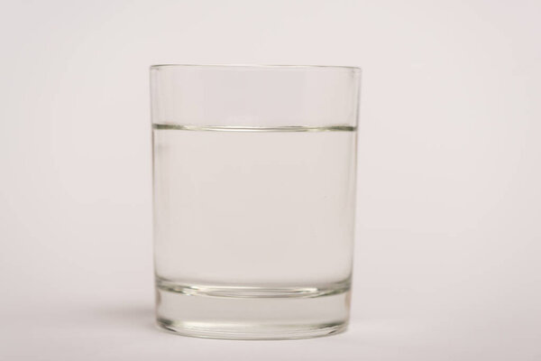 Close up view of glass of water on white surface