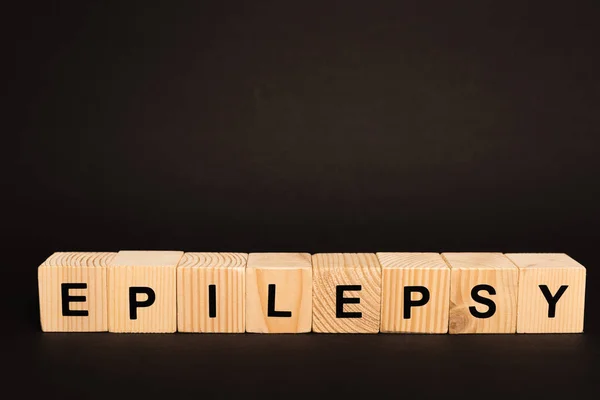 Dřevěné Kostky Epilepsií Písmo Izolované Černé — Stock fotografie