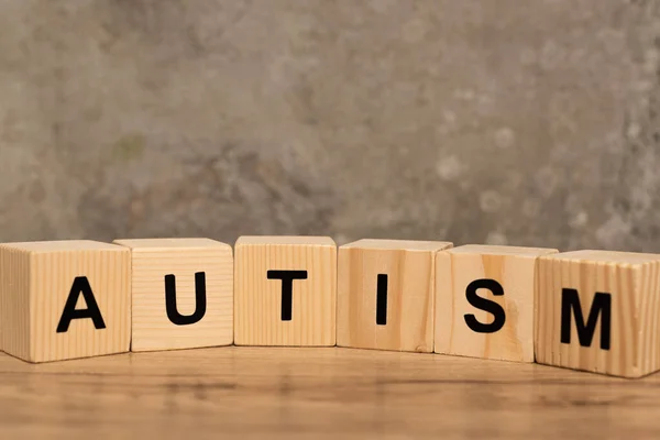 Cubes Autism Lettering Wooden Table Grey Background — Stock Photo, Image