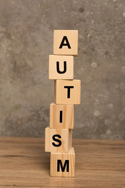 Stacked Blocks Autism Lettering Wooden Table Textured Grey Background — Stock Photo, Image