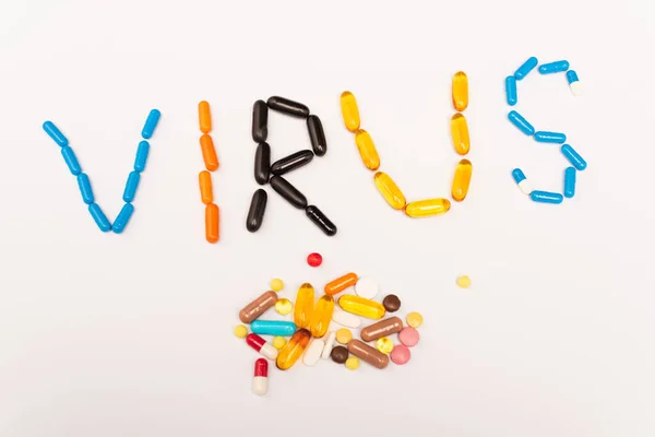 Top View Virus Lettering Pile Pills White Background — Stock Photo, Image