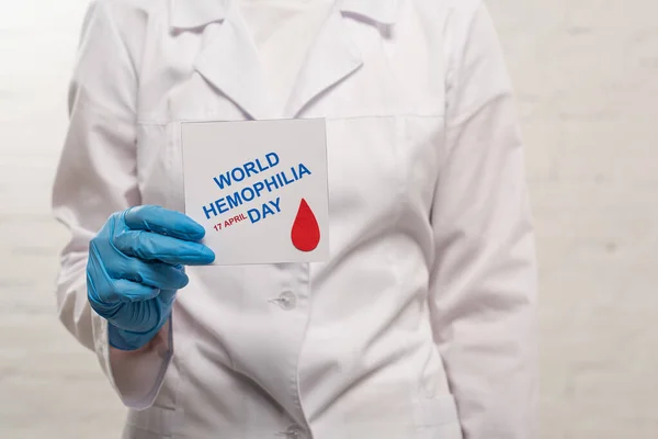 Cropped View Doctor Holding Card World Hemophilia Day White Background — Stock Photo, Image