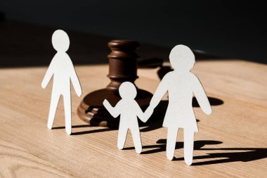 paper people near wooden gavel on table, divorce concept  clipart