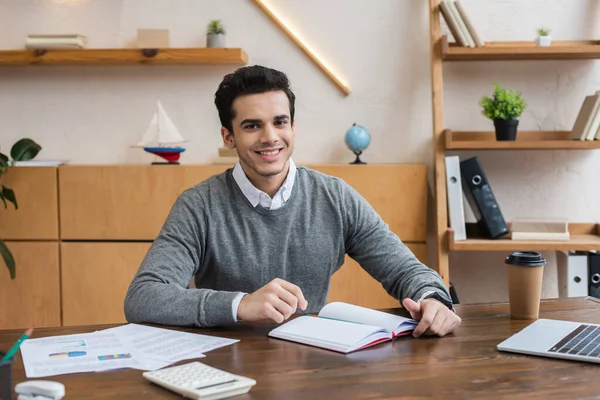 Selective Focus Businessman Notebook Smiling Looking Camera Table Office — Stock Photo, Image