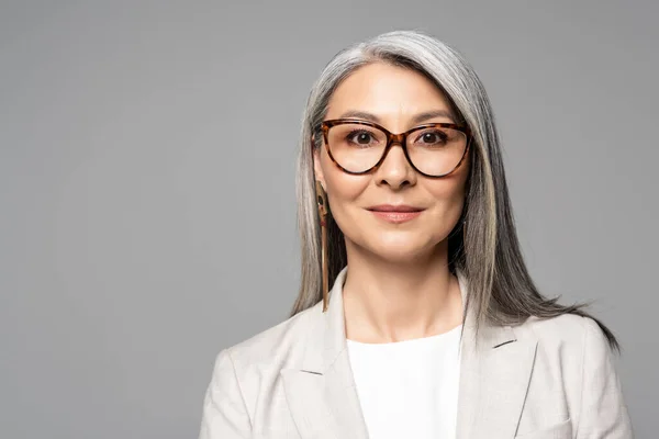 Attractive Smiling Asian Businesswoman Eyeglasses Isolated Grey — Stock Photo, Image