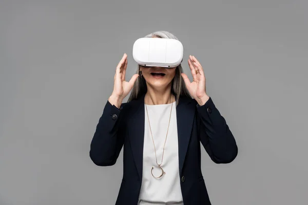 Attractive Surprised Businesswoman Using Virtual Reality Headset Isolated Grey — Stock Photo, Image