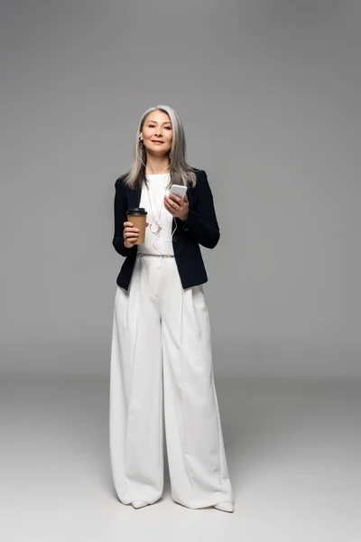 Beautiful Asian Businesswoman Coffee Listening Music Earphones Smartphone Grey — Stock Photo, Image