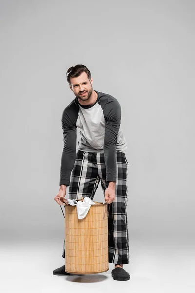 Bearded Man Holding Heavy Laundry Basket Dirty Clothing Grey — Stock Photo, Image