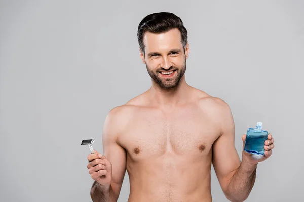 Cheerful Muscular Man Holding Shave Lotion Razor Isolated Grey — Stock Photo, Image