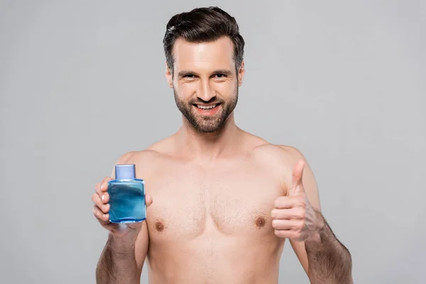 Happy Man Holding Bottle Shave Lotion Showing Thumb Isolated Grey — Stock Photo, Image