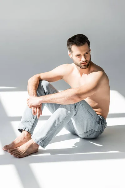 Sunshine Shirtless Man Blue Jeans Sitting Grey — Stock Photo, Image