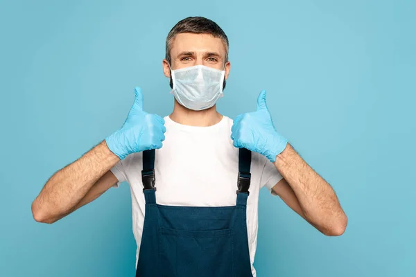 Cleaner Medical Mask Showing Thumbs Blue Background — Stock Photo, Image
