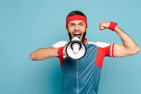 Emotional Stylish Sportsman Loudspeaker Showing Muscles Blue Background — Stock Photo, Image