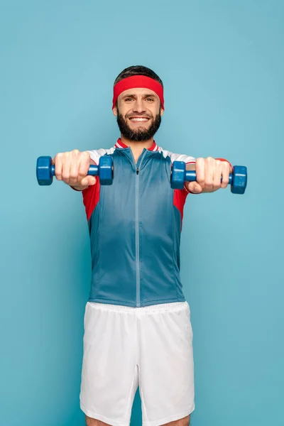 Smiling Stylish Sportsman Exercising Dumbbells Blue Background — Stock Photo, Image