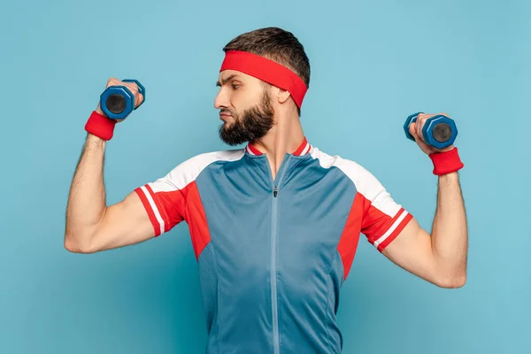 Serious Stylish Sportsman Exercising Dumbbells Blue Background — Stock Photo, Image