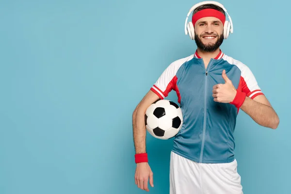 Happy Stylish Sportsman Headphones Soccer Ball Showing Thumb Blue Background — Stock Photo, Image