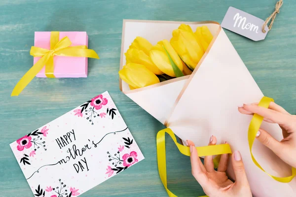 Cropped View Woman Touching Ribbon Yellow Tulips Greeting Card Happy — Stock Photo, Image