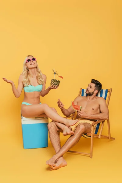 Excited Blonde Girl Sitting Portable Fridge Handsome Man Holding Slice — Stock Photo, Image