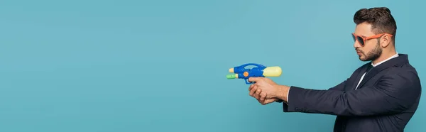 Panoramic Crop Businessman Sunglasses Holding Water Gun Isolated Blue — Stock Photo, Image