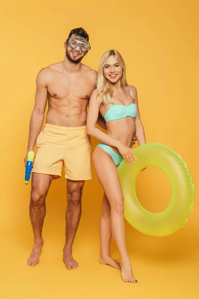 Smiling Man Diving Mask Holding Water Gun Hugging Blonde Girl — Stock Photo, Image