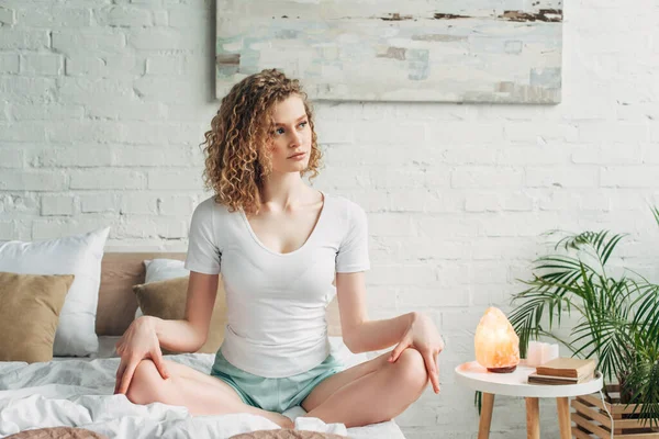 Beautiful Girl Sitting Lotus Pose Bed Bedroom Himalayan Salt Lamp — Stock Photo, Image