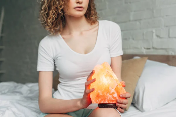 Cropped View Curly Woman Homewear Holding Himalayan Salt Lamp Bedroom — Stock Photo, Image