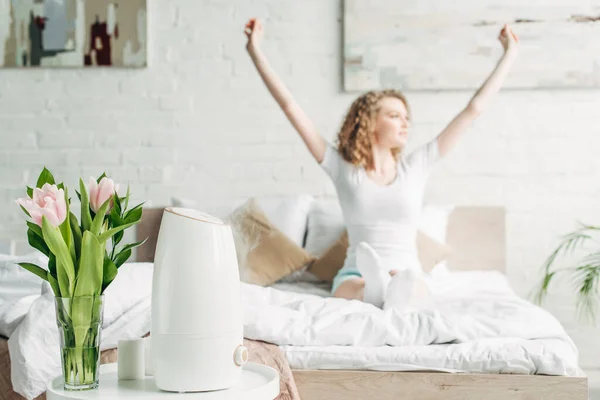 Selective Focus Happy Girl Stretching Bedroom Air Purifier Tulips — Stock Photo, Image