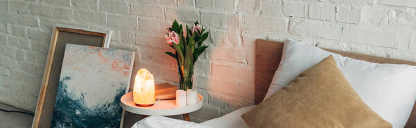 interior of bedroom with Himalayan salt lamp, panoramic orientation 