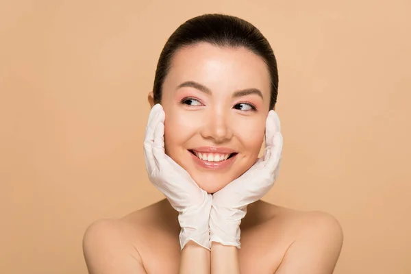 Beautiful Smiling Naked Asian Girl Latex Gloves Isolated Beige — Stock Photo, Image