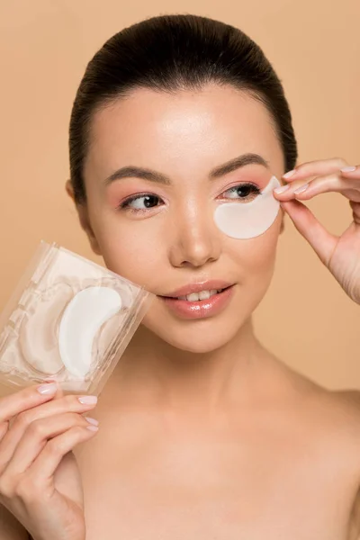 Beautiful Happy Nude Asian Woman Collagen Eye Pads Isolated Beige — Stock Photo, Image