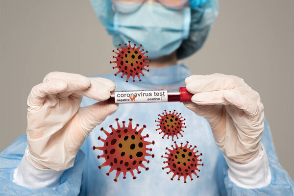 Selective focus of doctor holding test tube with blood sample of coronavirus lettering isolated on grey, bacteria illustration