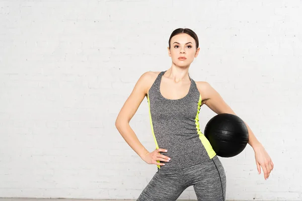 Attractive Woman Sportswear Standing Black Ball Hand Hip — Stock Photo, Image