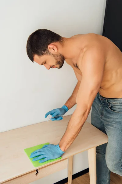 Shirtless Man Rubber Gloves Holding Rag Bottle Antibacterial Liquid Table — Stock Photo, Image