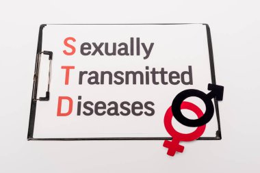 top view of clipboard with sexually transmitted diseases near gender symbols isolated on white clipart