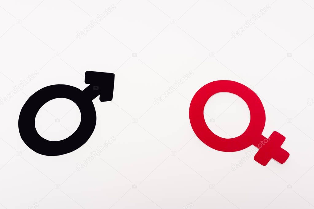 top view of black and red gender symbols isolated on white 