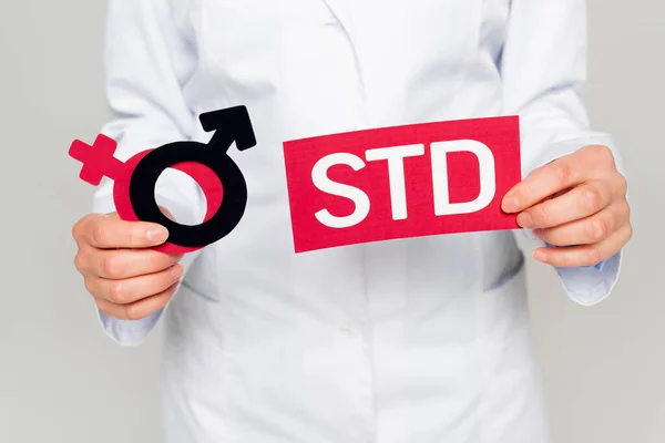 Cropped View Doctor White Coat Holding Gender Symbols Std Lettering — Stock Photo, Image