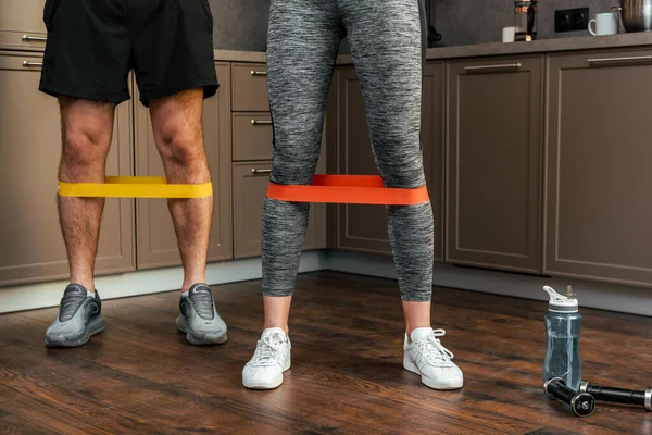 Cropped View Couple Exercising Together Resistance Bands Legs Home Quarantine — Stock Photo, Image