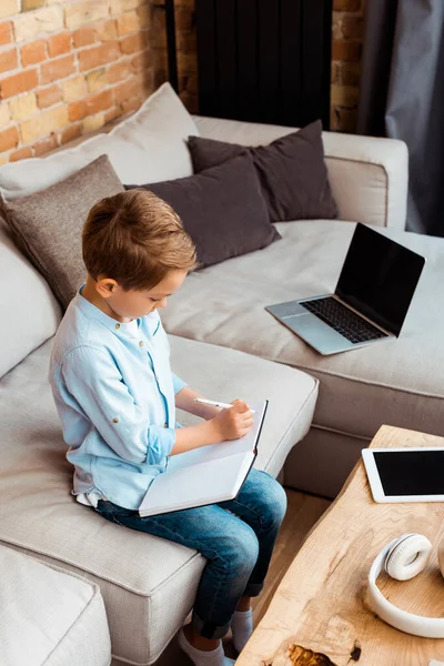 Cute Boy Writing Notebook Gadgets Blank Screen While Learning Home — Stock Photo, Image