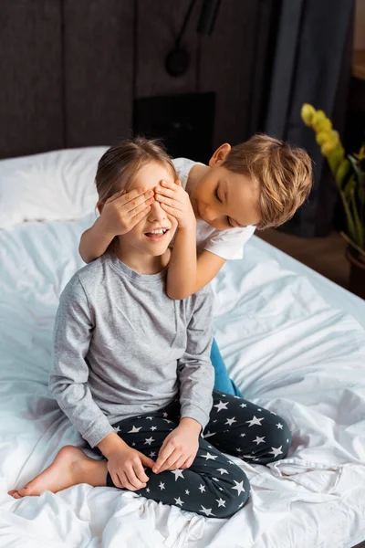 Cute Brother Covering Eyes Sister Bedroom — Stock Photo, Image