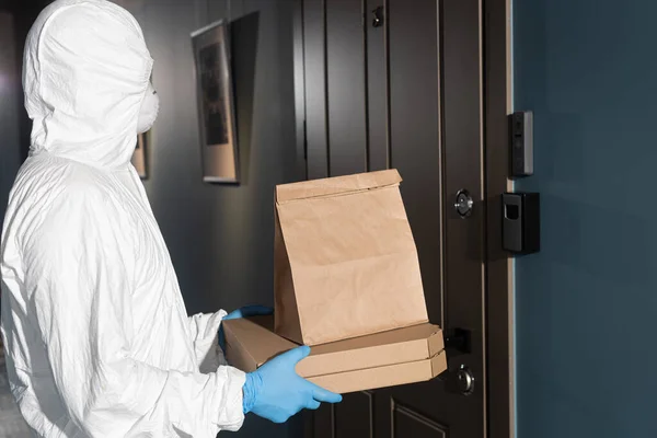 Side View Courier Hazmat Suit Medical Mask Holding Package Pizza — Stock Photo, Image