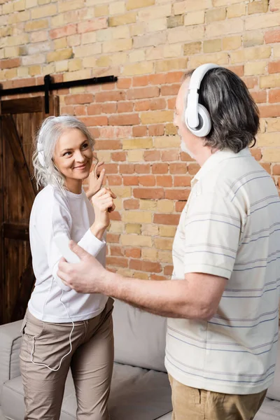 Happy Mature Couple Wireless Headphones Dancing Home — Stock Photo, Image