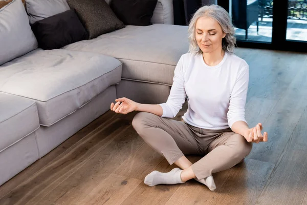 Relaxed Mature Woman Closed Eyes Sitting Lotus Pose — Stock Photo, Image