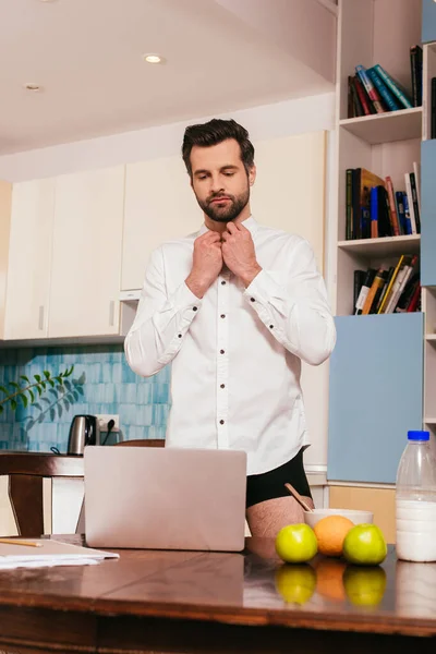 Selective Focus Handsome Man Panties Putting Shirt Laptop Breakfast Kitchen — Stock Photo, Image